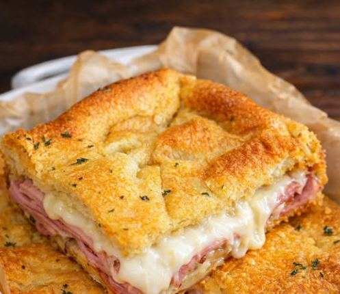 These hot ham and cheese sandwiches are baked until golde